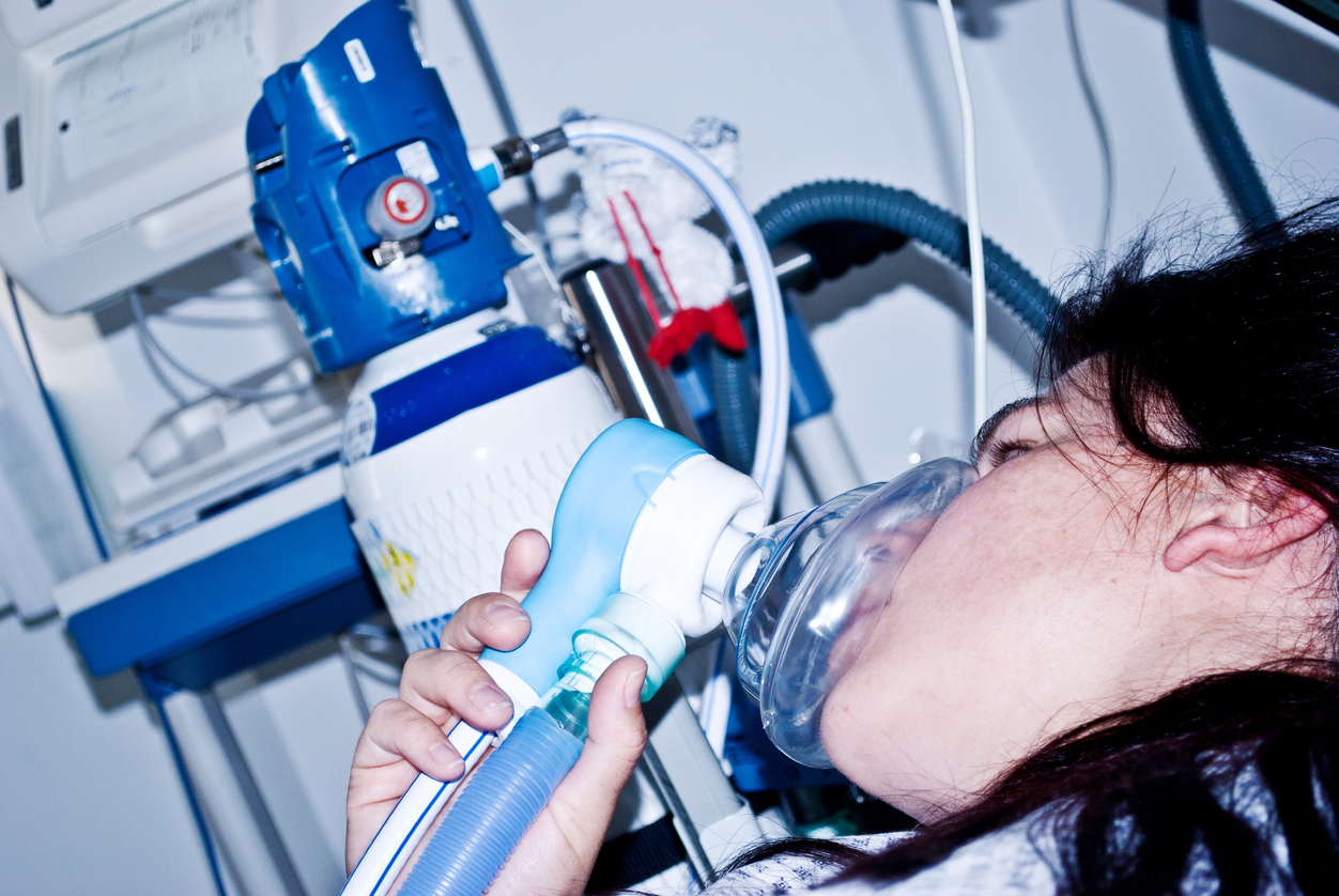 Soontobemother lying in hospital bed in labour pain and in